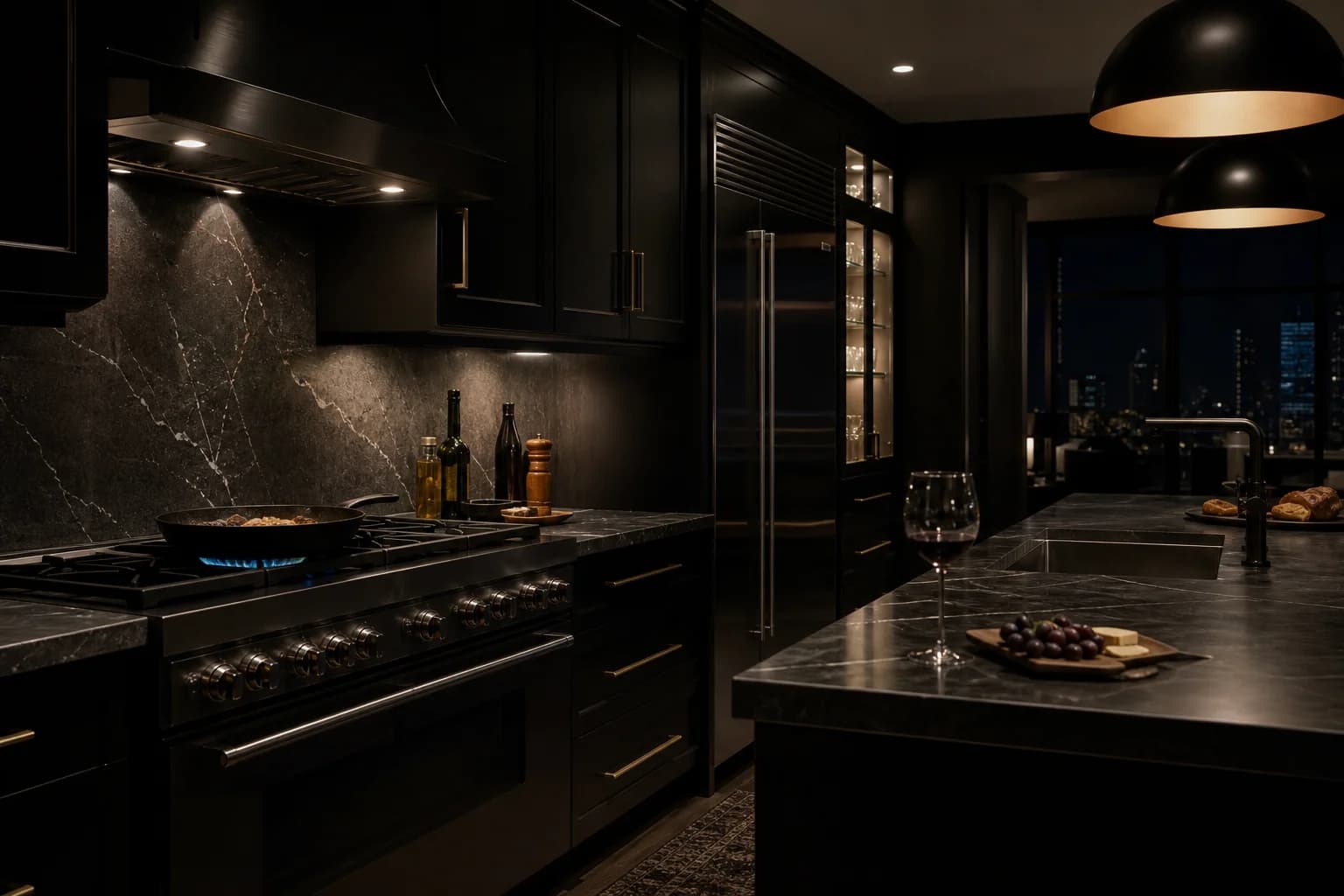 Dark luxury kitchen at night with cast iron on range, glass of wine, black cabinetry and charcoal marble